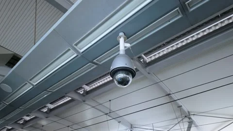 Dome Security CCTV Camera Mounted On Modern Building Ceiling Video stock 338386196