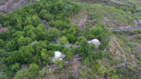 Dome Structures and Forest Pathways in Hilly Terrain, Rajasthan Stock Footage 312364716