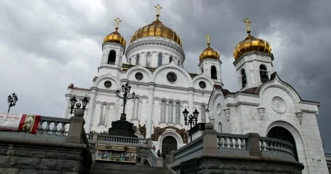 The dome of the Temple of Christ the Savior in the sun, looming clouds Stock Footage 66223863