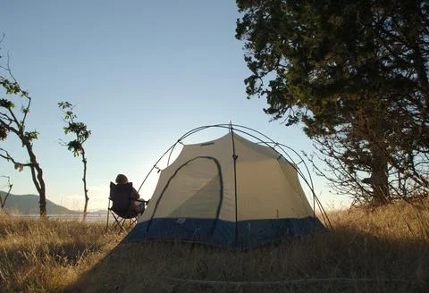 Dome tent set up in the grass, Cabbage Island, British Columbia Stock Photos