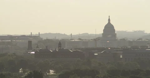 Dome of the US Capitol in haze, seen from Arlington National Cemetery. Shot in Stock Footage 59250176