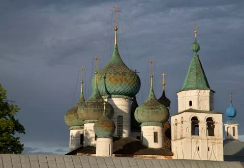 Domes of the church against dramatic cloudy sky Stock Photos