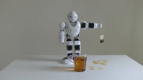 A domestic android humanoid robot helps making tea even stronger for his master Stock Footage 96596341