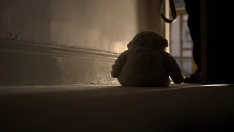 Domestic Child Abuse Concept With Father Kicking Away Teddy Bear, 4K Stock Footage