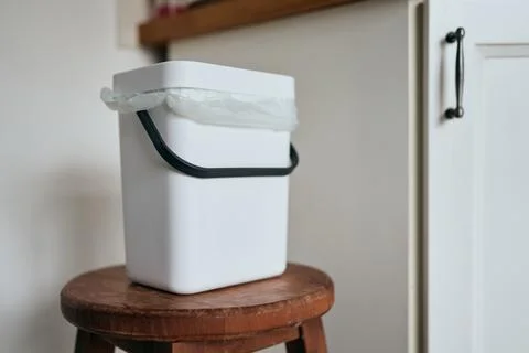 Domestic compost bin with compostable leftovers. Sustainable lifestyle concept Stock Photos