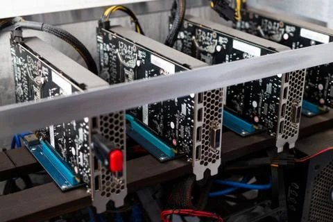 Domestic gpu crypto mining rig under dust Stock Photos