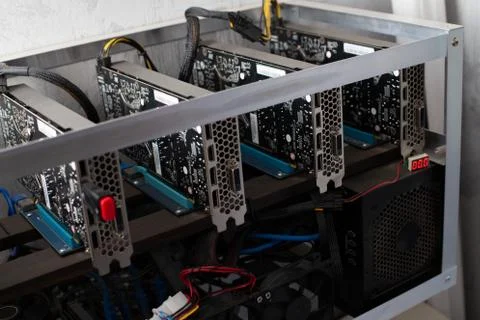 Domestic gpu crypto mining rig under dust Stock Photos