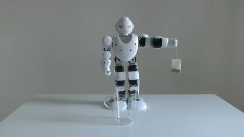 A domestic humanoid robot practicing brewing tea, poor artificial intelligence 스톡 동영상 97805099