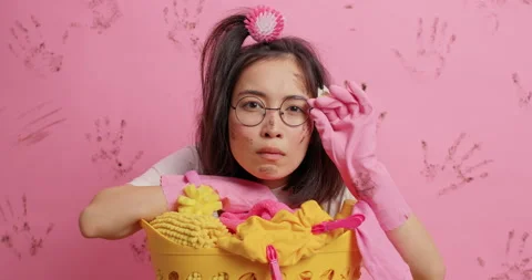 Domestic tasks and workload concept. Attentive brunette young Asian woman wears Stock Footage 151980809