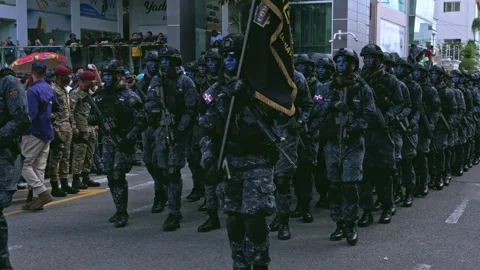 Dominican special forces with blue face paint marching in a parade Video stock 328835601