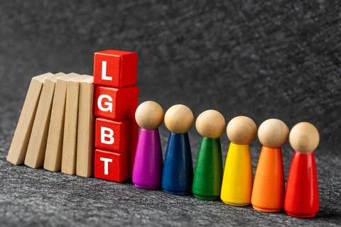 The domino effect is about to bring down the red blocks with the LGBT Stock Photos