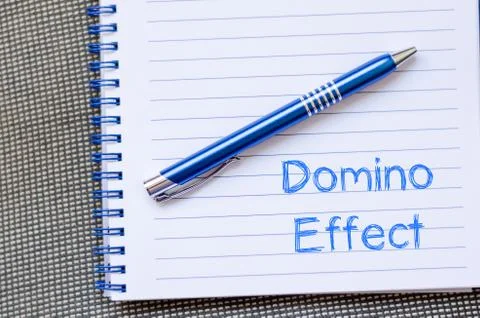 Domino effect concept on notebook Stock Photos