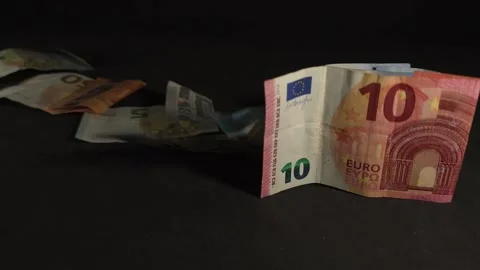 The domino effect with falling euro banknotes revealing a Mexican peso bill.. Stock Footage 320083438