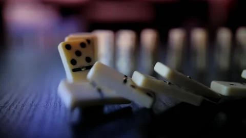 Domino Falling on a Table Video stock 133644317