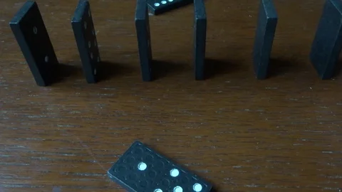 Dominoes are falling Stock Footage 98697937