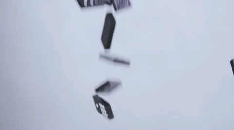 Dominoes falling down from above through picture Stock Footage 58761469