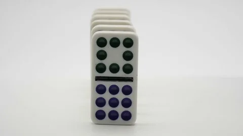 Dominos slowly falling down forward close up Stock Footage 81074715