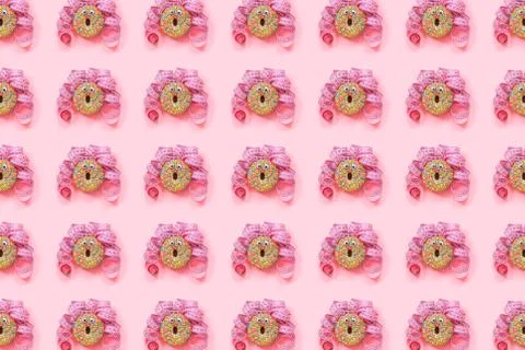 Donat pattern on pink background. Abstract funny face of woman from donut wit Foto stock
