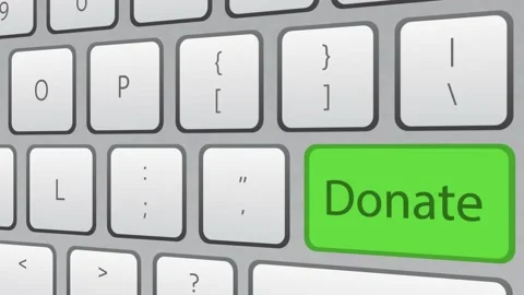 Donate green key button being clicked on white keyboard. Stock Footage 221332561