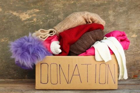 Donation box with clothes. Stock Photos