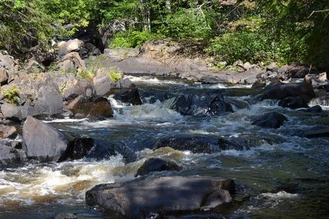 Doncaster River in Sainte-Adèle, Quebec during a sunny and hot summer day. Stock Photos