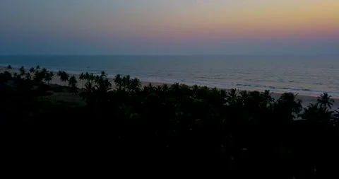 A done flying over the Utorda beach capturing the sunset in South Goa, Stock Footage 172358896