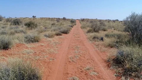 Done flys over a dirt road in the arid semi-desert of South Africa Stock Footage 90024336