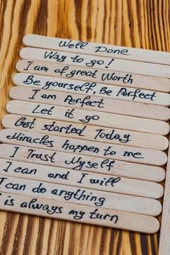 Done, positive thoughts for self esteem on wooden sticks Stock Photos