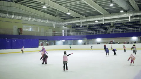 DONETSK, UKRAINE - NOVEMBER 24, 2018: Sport ice skating girls and boys learns Stock Footage 106531953