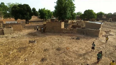 Donkey and villagers Stock Footage 80532387