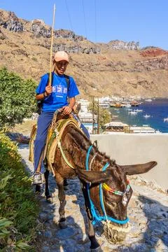 Donkey handler and his Donkey, the village Thirasia Stock Photos