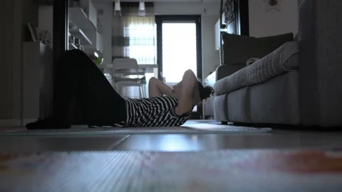 Donna trains at home Stock Footage 130536672