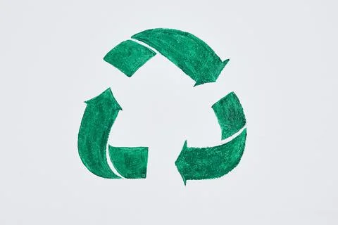 Dont be mean, keep it green. Shot of a green recycle symbol painted on a wall Illustrazione stock