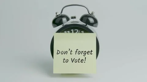 Don't Forget To Vote Text or Word on Yellow Note Paper Sticking onto Clock Stock Footage 299181058