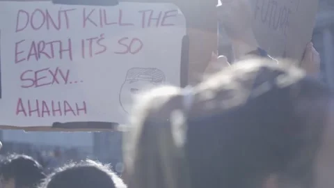 Don't Kill the Earth it's so Sexy Climate Protest Sign Stock Footage 139249589