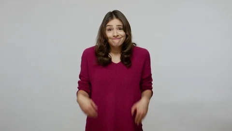 Don't know answer. Confused clueless uncertain brunette woman in pullover Stock Footage 124291828