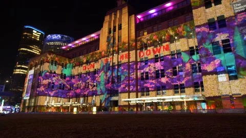 'Dont Let Me Down' projected on a building on Vivid night 4K Stock Footage 165631013