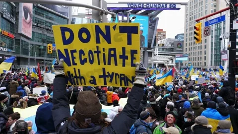 Don't negotiate with a Tyrant sign. Protest against Russian invasion of Ukraine. Video stock 171185853