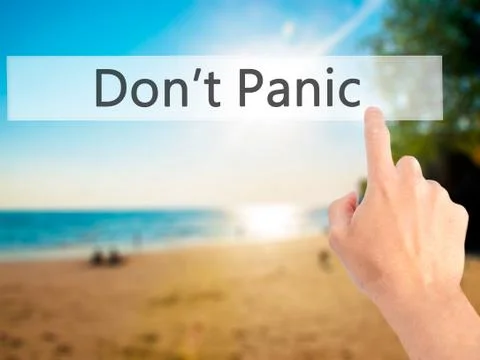 Don't Panic - Hand pressing a button on blurred background concept on visual  Foto stock
