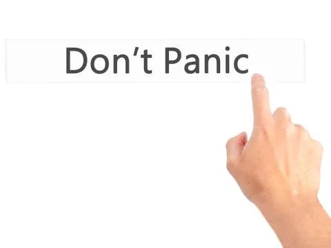Don't Panic - Hand pressing a button on blurred background concept on visual  Foto stock