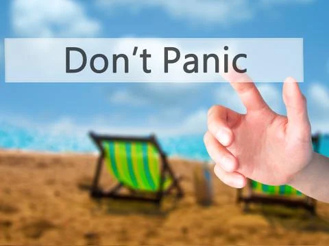 Don't Panic - Hand pressing a button on blurred background concept on visual  Foto stock