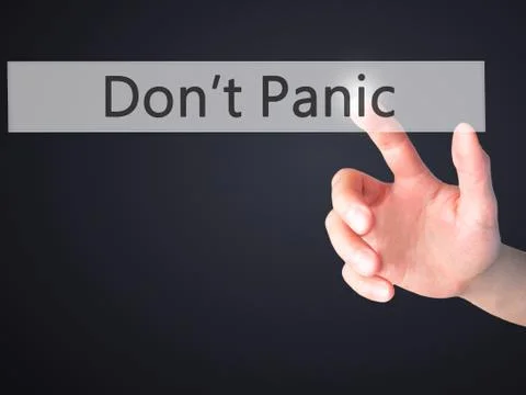 Don't Panic - Hand pressing a button on blurred background concept on visual  Stock Photos