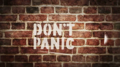 Don't panic sign spray painted on the brick wall 動画素材 150549590