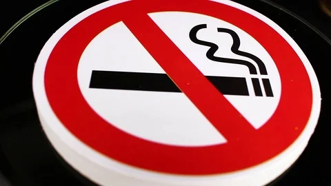 Don't smoking do not smoke sign closeup texture video on rolling rotating Stock Footage 104324671