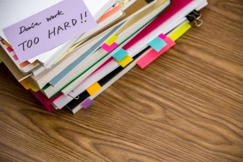 Don't Work Too Hard; The Pile of Business Documents on the Desk Stock Photos