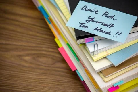 Don't Work Too Hard; The Pile of Business Documents on the Desk Stock Photos