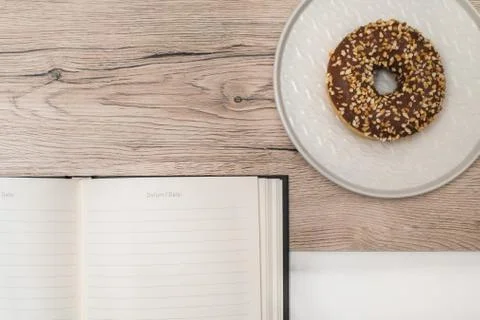 Donut and notepad Stock Photos