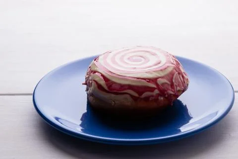 Donut on blue plate Stock Photos