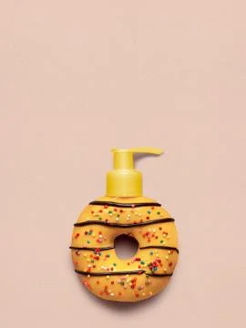Donut with dispenser. Stock Photos