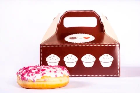 Donut in front of box Stock Photos